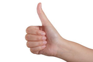 Woman hands thumbs up. Isolated on white